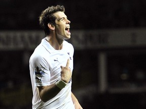 Tottenham Hotspur's Welsh defender Gareth Bale celebrates scoring the third goal during their English Premier League football match against Queen Park Rangers at White Hart Lane in London, England on October 30, 2011.