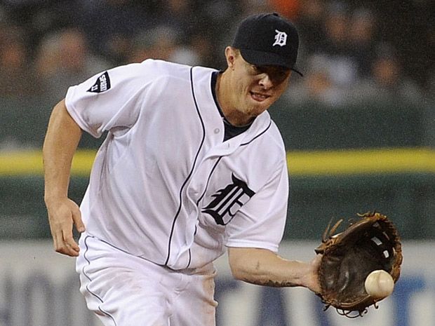 American League's Brandon Inge of the Detroit Tigers flips his bat