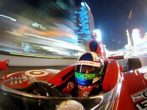 LAS VEGAS - OCTOBER 13:  Dario Franchitti of Scotland, driver of the #10 Target Chip Ganassi Racing Dallara Honda, drives a parade lap down the Las Vegas Boulevard Strip as a preview to the IndyCar World Series Championship on October 13, 2011 in Las Vegas, Nevada.  (Photo by Jonathan Ferrey/Getty Images for IndyCar)