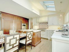 Light streams in from a skylight in the kitchen.