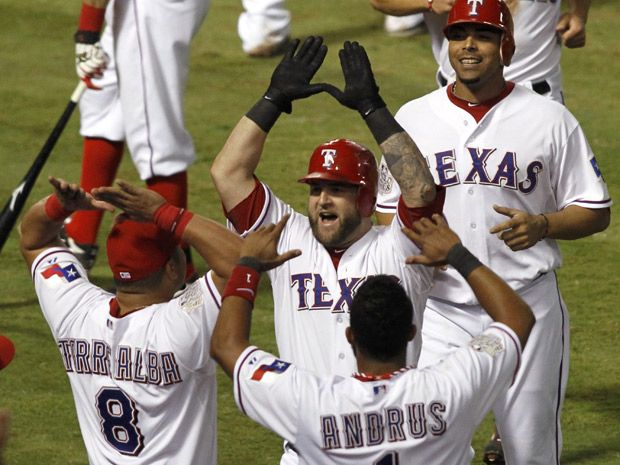 Texas Rangers' Josh Hamilton connects on a two-run home run scoring Elvis  Andrus during the 10th inning of game 6 of the World Series against the St.  Louis Cardinals at Busch Stadium