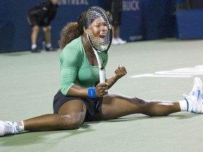 Serena Williams of USA reacts celebrates after making a shot against Jie Zheng of China during Rogers Cup tennis action in Toronto, Thursday, August 11, 2011.