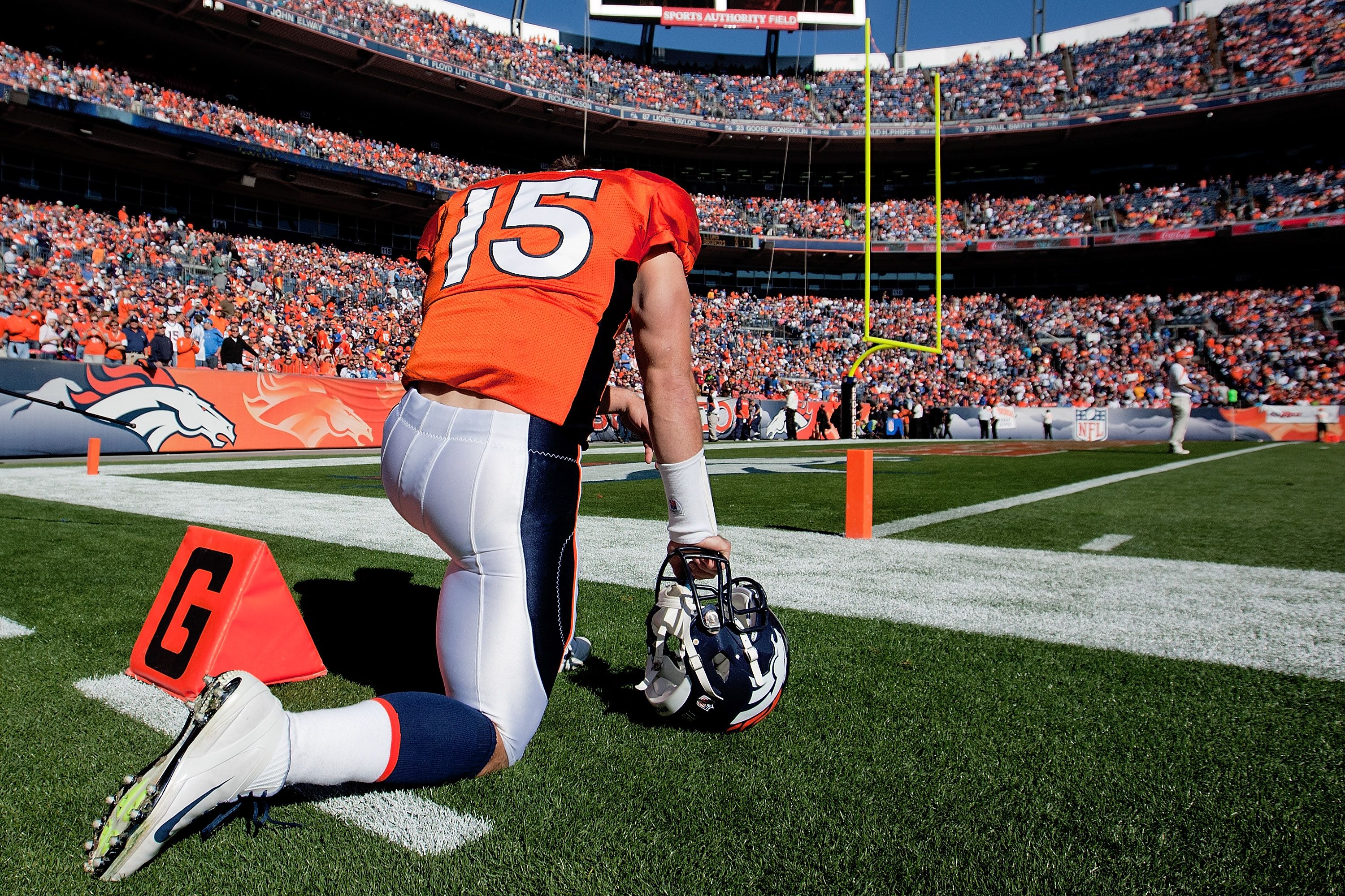 Jerseys worn by Tim Tebow fans commemorate the various phases of his  athletic career