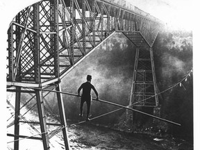 Samuel Dixon walking tight rope across Niagara Falls.