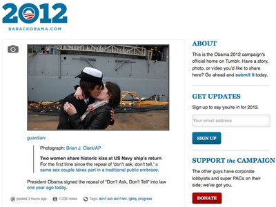 Traditional first kiss upon return of USS Oak Hill exchanged between two  lesbian sailors 