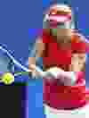 Ekaterina Makarova of Russia hits a return to Tamarine Tanasugarn of Thailand during their women's singles match at the Australian Open tennis tournament in Melbourne January 17, 2012.