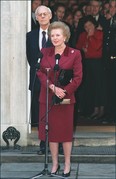 British Prime Minister Margaret Thatcher flanked by her husband Denis (L), addresses the press, 28 November 1990 for the last time in front of 10 Downing Street in London prior to hand her resignation as prime minister to Queen Elizabeth II. SEAN DEMPSEY/AFP/Getty Images