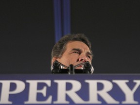 Republican presidential candidate and current Texas Governor Rick Perry addresses an Iowa Caucus night rally in Des Moines, Iowa, January 3, 2012.   REUTERS/ (UNITED STATES  - Tags: POLITICS ELECTIONS POLITICS)