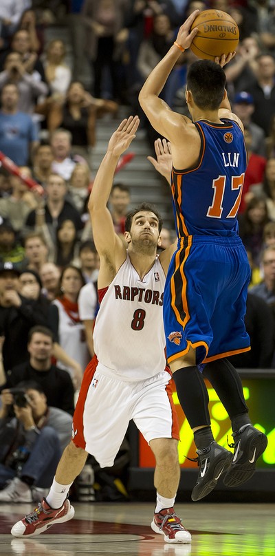 Toronto Raptors Jose Calderon, right steals the ball from New York Knicks  shooting guard Jeremy Lin, left, during first half action at the Air Canada  Centre, in Toronto, Canada on Tuesday, February