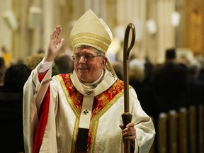 Cardinal Collins blesses those in attendance at St. Michael’s Cathedral in 2012.