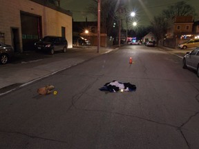 The scene where Kenneth Mark was murdered on  Dec. 29, 2009, which shows clothes on the street that were cut off by paramedics.