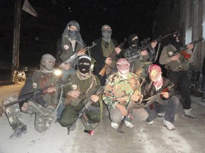 Syrian soldiers who defected to join the Free Syrian Army are seen in Kafar Batna, near Damascus, January 31, 2012.