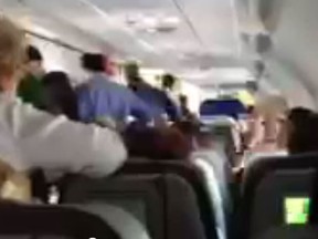 A Jetblue pilot, who had to be restrained after he had a mid-flight outburst about Al-Qaeda and rammed the cockpit doors, is in FBI custody, the head of the airline said Wednesday. A passenger captured video on his cell phone of the pilot's erratic behaviour.