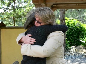 Hanne Andersen, who was teenaged and unmarried when she says she was forced to surrender her baby, said unwed mothers were systematically “targeted” for their babies from the 1940s until the 1980s. In this photo, she is hugging her daughter, Ocean Condon, for the first time, in 2006.