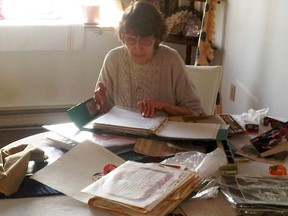 Yvonne Prior looks over her files and notes at the table she spends hours at each day, searching for clues to her daughter's murder.