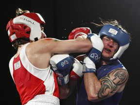 Patrick Brazeau and Liberal MP Justin Trudeau during their charity boxing match in Ottawa Saturday.