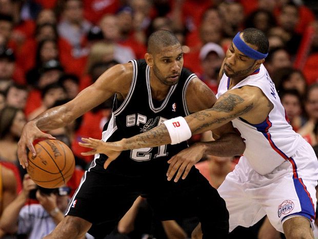 Tim Duncan of the San Antonio Spurs sits on the floor during Game News  Photo - Getty Images