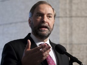 NDP leader Tom Mulcair speaks with the media about his visit to the oilsands following party caucus meetings on Parliament Hill in Ottawa, Wednesday May 30, 2012.