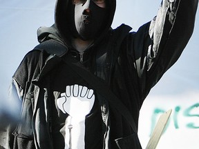 TORONTO, ON: NOVEMBER 23, 2011--An Occupy Toronto protestor raises his hand as Police and City of Toronto workers moved in to clean up and evict Occupy Toronto protesters at Toronto's St. James Park, Wednesday November 23, 2011.  (Peter J. Thompson/National Post) (Story by Peter Kuitenbrouwer/National Post/National)  //NATIONAL POST STAFF PHOTO