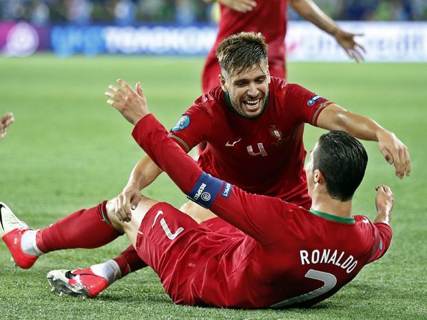 Spain's Jordi Alba pulls Portugal's Cristiano Ronaldo shirt Stock