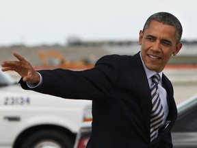 U.S. President Barack Obama waves upon his arrival at O'Hare International Airport in Chicago, Illinois on June 1, 2012 for campaign events. Obama gets a rare chance to sleep in his own bed at his home while in Chicago.