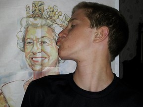 Adam Sharp kisses the picture of the Queen.