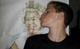 Adam Sharp kisses a portrait of the Queen.