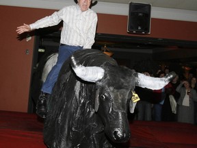 Local Input~ Calgary-061025-Lawyers from Fraser Milner Casgrain LLP (FMC),law firm, broke out the cowboy hats and Wranglers to raise funds today for the Calgary United Way by having lawyers pay up for a good cause or take on a dreaded mechanical bull.Quincy Smith, Q.C., Managing Partner, FMC Calgary, and last year?s Co-Chair of the Calgary United Way Campaign rides the mechanical bull...Dean Bicknell / Calgary Herald (For City story by don't know Assignment ID#00005680A) Wireless Ridge: Last Argentine position Ã on the outskirts of Stanley. Fell after night battle 13 JuneÃ­82.