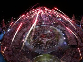 Fireworks explode over the Olympic Stadium during the opening ceremony of the London 2012 Olympic Games July 27, 2012.  REUTERS/Pawel Kopczynski (BRITAIN  - Tags: OLYMPICS SPORT TPX IMAGES OF THE DAY)