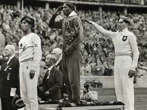 American track star Jesse Owens, centre, proved to Nazi Germany and the rest of the world at the 1936 Olympics in Berlin that skin colour does not determine a person's ability.