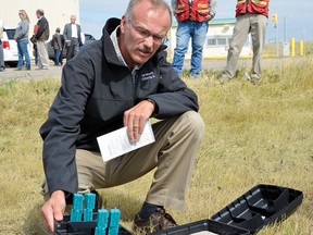 Wednesday August 15, 2012 NEWS PHOTO ALEX MCCUAIG Alberta Agriculture inspector Rob Pulyk shows some of the baited traps being used to try to eraticate a rat infestation at the Medicine Hat landfill. A total of 40 dead rats from the colony have been recovered from the traps so far.