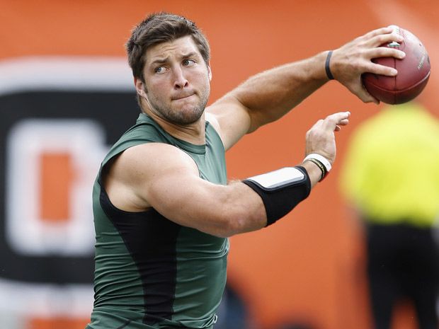 Tim Tebow -- Jacked, Shirtless, Tossing Children