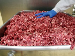 A bin of ground beef is seen at the Fresh & Easy Neighborhood Market meat processing facility in Riverside, California on March 29, 2012. U.S. meat packers' losses on beef sales doubled when a controversy over ammonia-treated scraps dubbed "pink slime" exploded that year. A major lawsuit involving the media coverage is now underway.