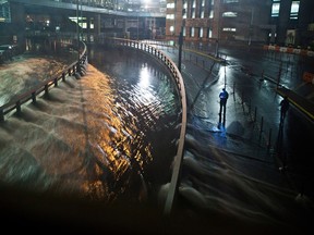 NEW YORK, NY - OCTOBER 29:  Water rushes into the Carey Tunnel (previously the Brooklyn Battery Tunnel), caused by Hurricane Sandy, October 29, 2012, in the Financial District of New York, United States. Hurricane Sandy, which threatens 50 million people in the eastern third of the U.S., is expected to bring days of rain, high winds and possibly heavy snow. New York Governor Andrew Cuomo announced the closure of all New York City will bus, subway and commuter rail service as of Sunday evening  (Photo by Andrew Burton/Getty Images)