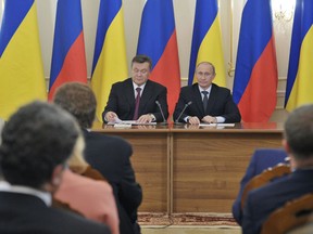 Russian President Vladimir Putin (R) holds a joint new conference with his Ukrainian counterpart Viktor Yanukovich at the Novo-Ogaryovo residence outside Moscow October 22, 2012.  REUTERS/Alexei Nikolsky/RIA Novosti/Pool (RUSSIA - Tags: POLITICS) THIS IMAGE HAS BEEN SUPPLIED BY A THIRD PARTY. IT IS DISTRIBUTED, EXACTLY AS RECEIVED BY REUTERS, AS A SERVICE TO CLIENTS