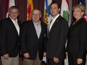 ew Brunswick Premier David Alward, Nova Scotia Premier Darrell Dexter, Prince Edward Island Premier Robert Ghiz and Newfoundland and Labrador Premier Kathy Dunderdale, left to right, pose for a group photo as the four Atlantic premiers attend their annual meeting in Brudenell, P.E.I., in June. (Andrew Vaughan/The Canadian Press)