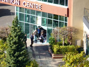 Burnaby, BC - Nov. 26, 2012 -- A photo taken by Gordon Shank from his living room window shows the aftermath of a shooting at the Executive Hotel and Conference Centre on Lougheed Highway in Burnaby. Photo by Gordon Shank. ORG XMIT: POS1211261534585062