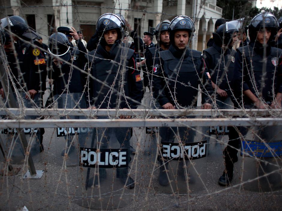 Egyptian Police Fire Tear Gas As Protesters Tear Down Barbed Wire Barricade Outside Morsi S