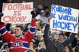 Dave Chidley / the canadian press
Fans holds signs commenting on the NHL lockout during a CFL game in Hamilton, Ont., on Friday, Oct. 12, 2012.