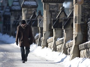 A man braves temperatures that feel like -40C with windchill in Ottawa on Wednesday.