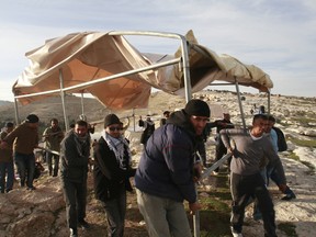 AP Photo/Nasser Shiyoukhi