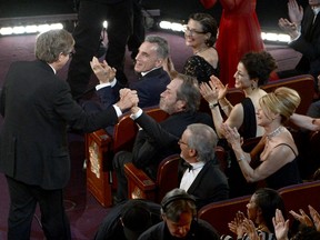HOLLYWOOD, CA - FEBRUARY 24:  Production designer Rick Carter shakes hands with director Steven Spielberg before Carter accepts the Best Production Design award for "Lincoln" onstage during the Oscars held at the Dolby Theatre on February 24, 2013 in Hollywood, California.  (Photo by Kevin Winter/Getty Images)