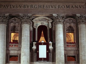 Pope Francis speaks from the central balcony of St. Peter's Basilica.