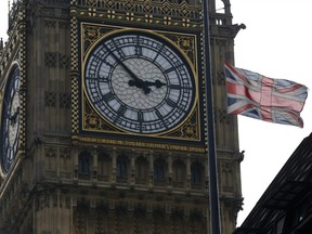 A British union flag flies at half-staff atop Portcullis House, backdropped by Big Ben's clock tower in London, Monday, April 8, 2013, in respect for former British Prime Minister Margaret Thatcher who died Monday following a stroke at age 87. Flags were flown at half-staff at Buckingham Palace, Parliament and Downing Street in honour to the 87-year old Iron Lady, and Queen Elizabeth II authorized Thatcher to have a ceremonial funeral to be held at St. Paul's Cathedral in London with military honors. (AP Photo/Sang Tan)