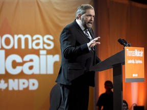 NDP Leader Thomas Mulcair addresses delegates following a confidence vote during the party's weekend convention Saturday, April 13, 2013 in Montreal. THE CANADIAN PRESS/Paul Chiasson