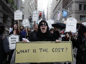 Protestors chant during an Occupy Wall Street march, Monday, Sept. 17, 2012, in New York.