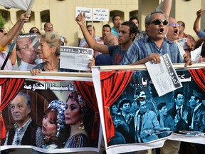 Employees of the Cairo Opera House and opponents of President Mohamed Morsi protest inside the Opera's compound in Cairo on May 30, 2013.