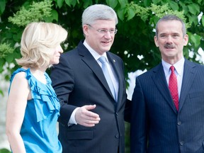 Commander Chris Hadfield participated in a photo op with Prime Minister Stephen Harper and his wife Laureen Harper on Monday at 24 Sussex. Hadfield announced on Monday he’s retiring from the space program