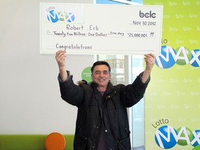 Robert Erb of Terrace, British Columbia, with his $25-million cheque after winning the Lotto Max draw in 2012.