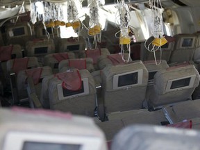 This handout photo provided July 7, 2013 by the National Transportation Safety Board(NTSB), shows an interior view of Asiana Flight 214 during their first site assessment by the NTSB in San Francisco, California. US officials were combing through the wreckage of an Asiana Airlines Boeing 777 passenger jet in San Francisco Sunday, as they tried to determine why it crashed onto the runway July 6, killing two people and injuring 182 others. The crash sheared off the plane's landing gear and tore the tail off the fuselage. Large portions of the plane's body were burned out in the fire that then erupted. But National Transportation Safety Board chief Deborah Hersman said much of the destruction isn't visible in the pictures and footage shown in the news.  AFP PHOTO/ HANDOUT / NTSB     == RESTRICTED TO EDITORIAL USE / MANDATORY CREDIT: "AFP PHOTO / National Transportation Safety Board(NTSB)  / NO SALES / NO MARKETING / NO ADVERTISING CAMPAIGNS / DISTRIBUTED AS A SERVICE TO CLIENTS ==HO/AFP/Getty Images